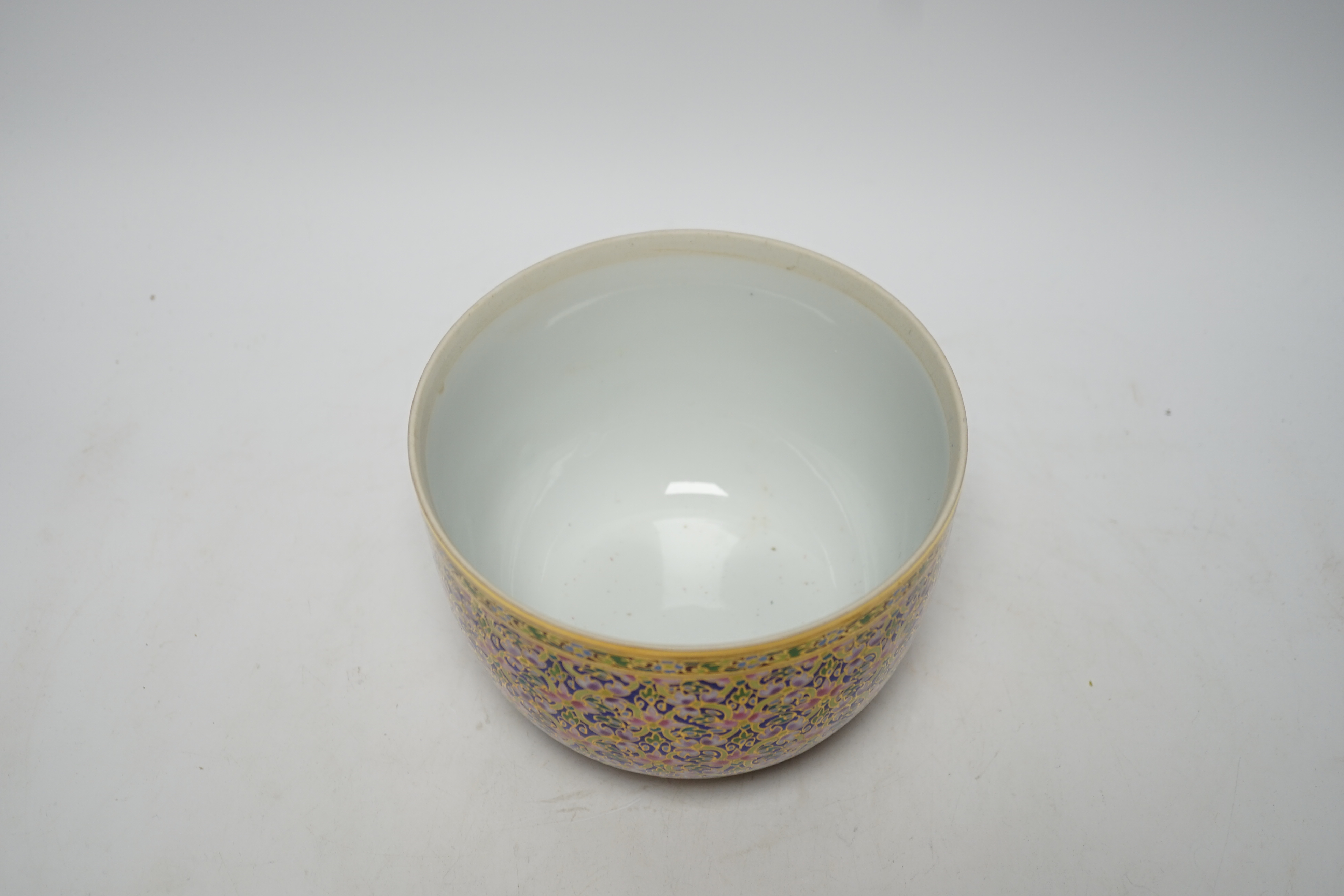 A Continental porcelain bowl and cover enamelled with flowers, 21cm high